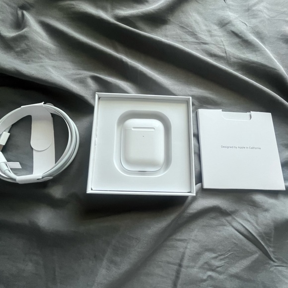 Apple AirPods with White Charging Accessories